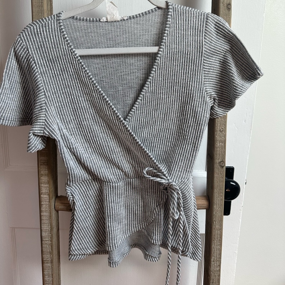 Cross body peplum shirt